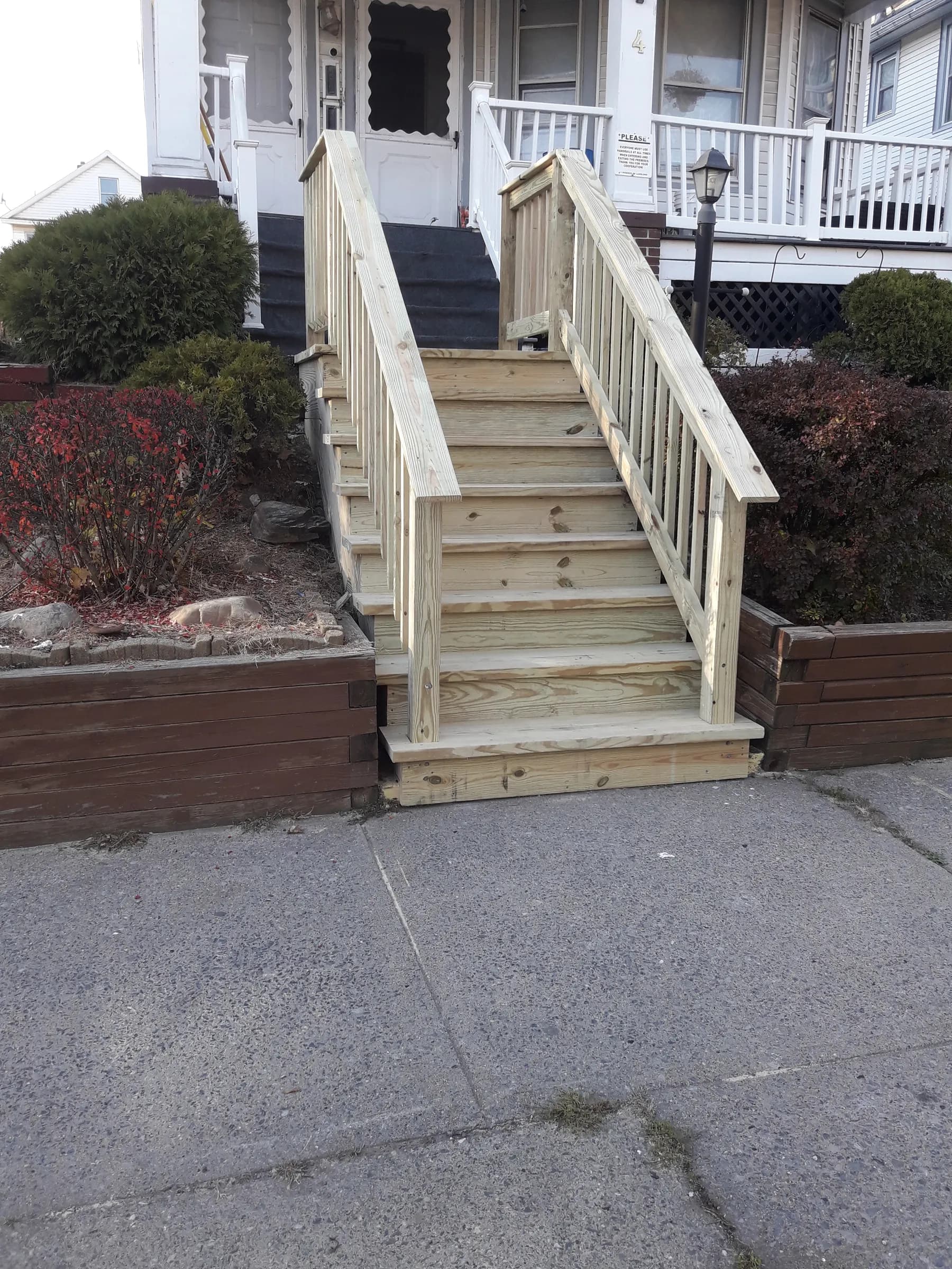 Wood porch and entry staircase front view
