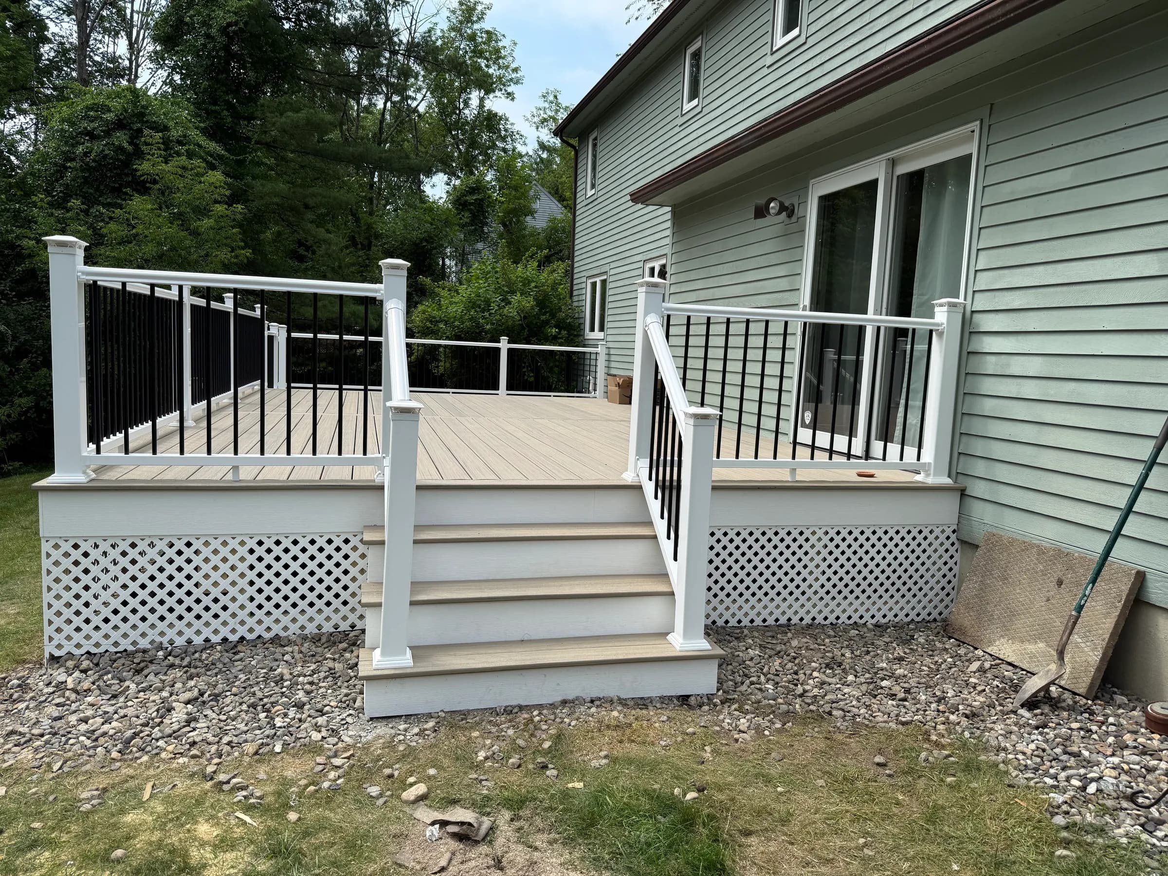 Composite deck with white railings and lattice skirt