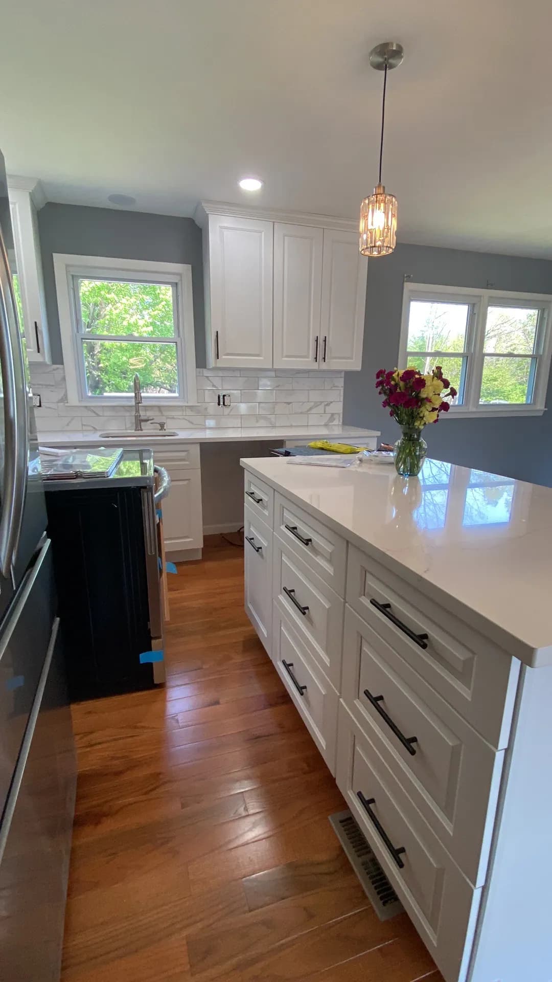 Bright kitchen with large island and double windows