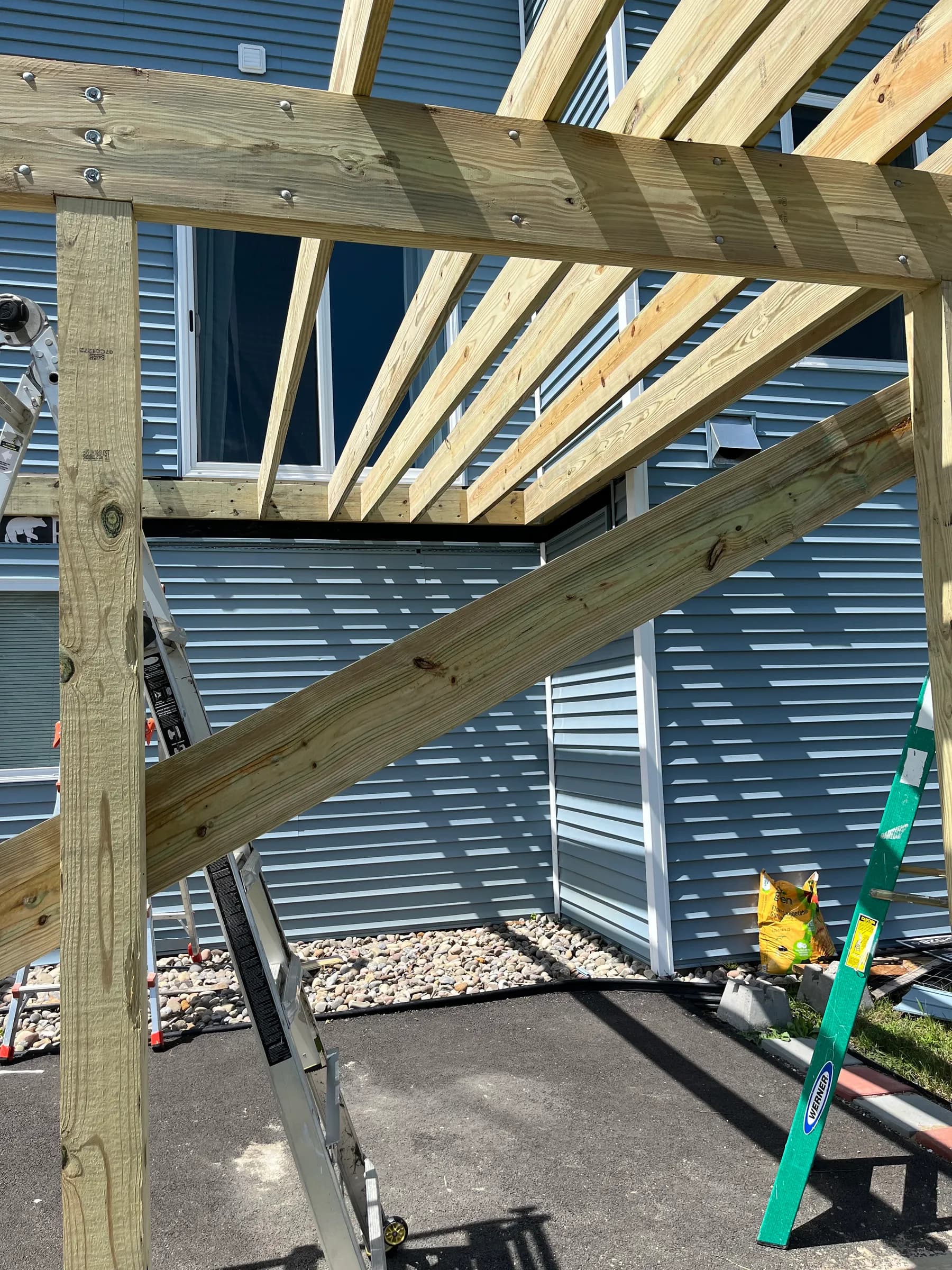 Pergola frame detail with pressure-treated beams