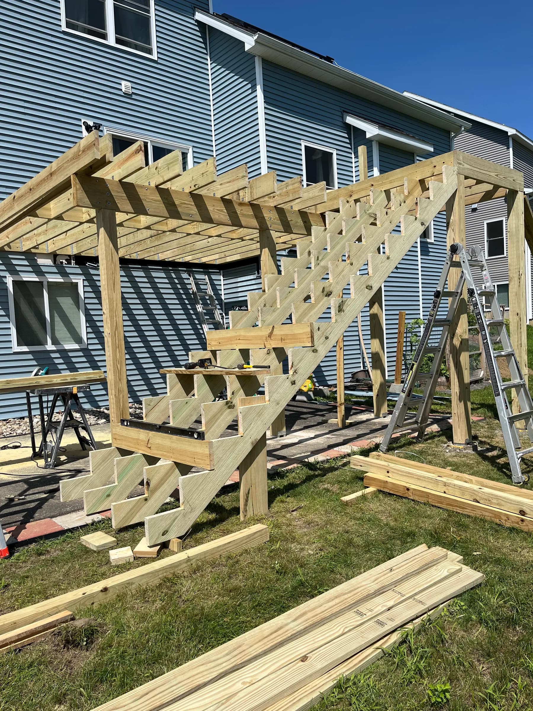 Elevated pergola structure on metal roof