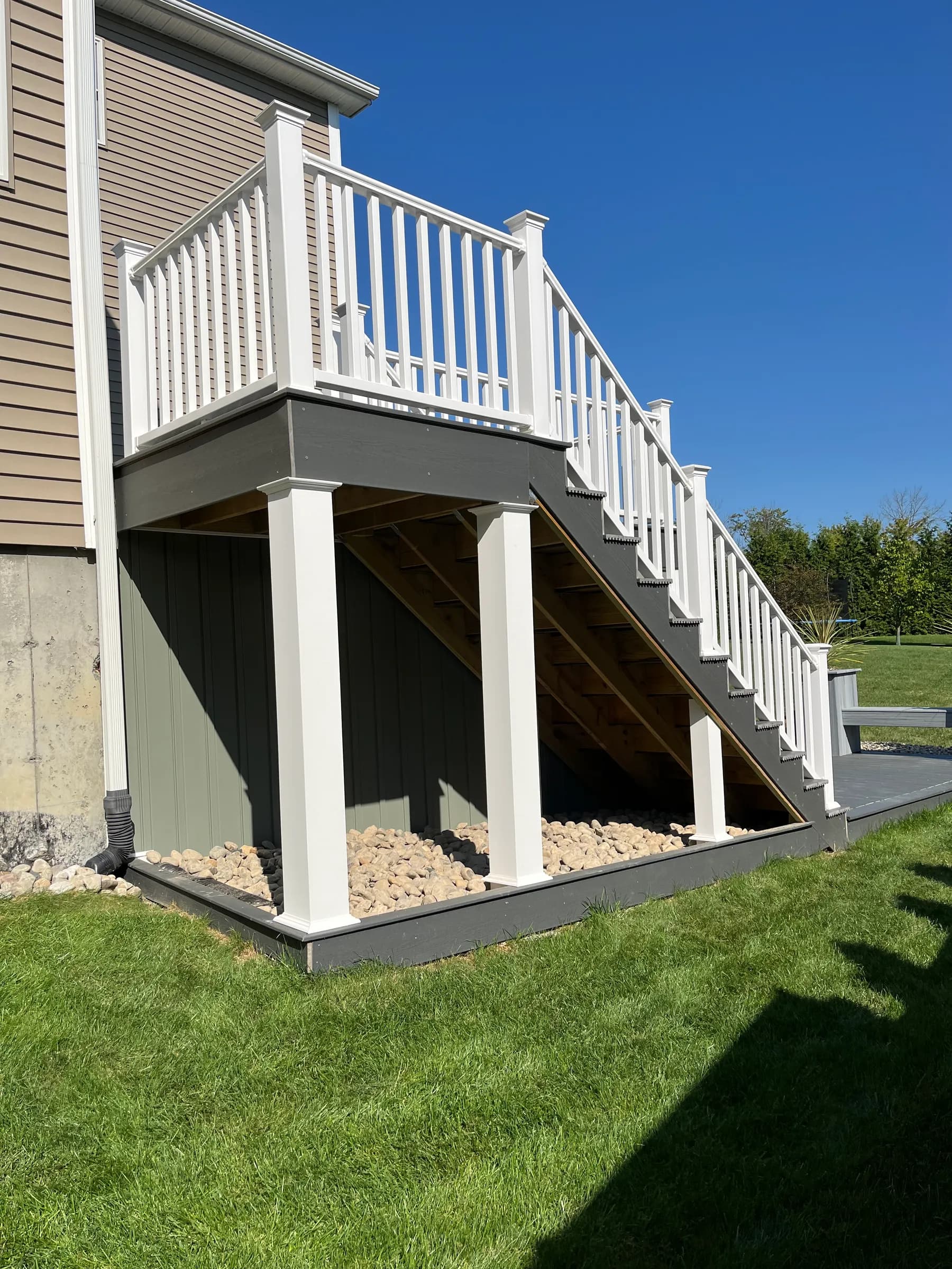White railings on elevated deck with dark trim