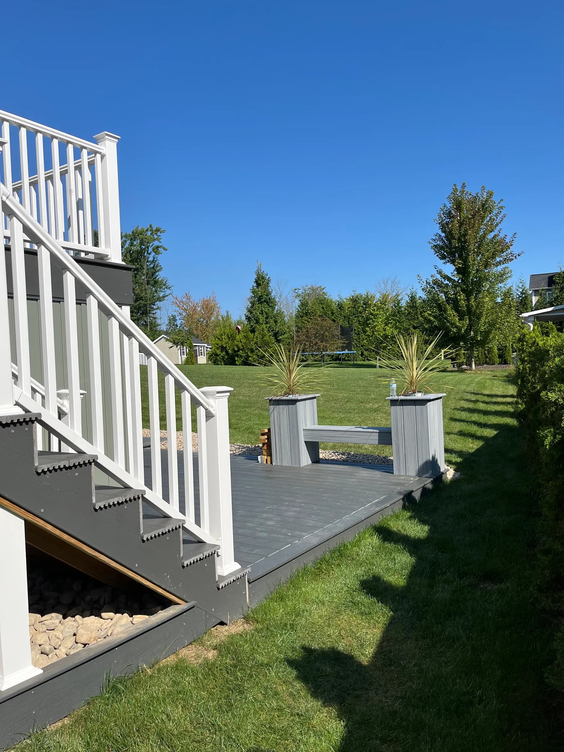Deck with outdoor furniture, grill, and fire pit area
