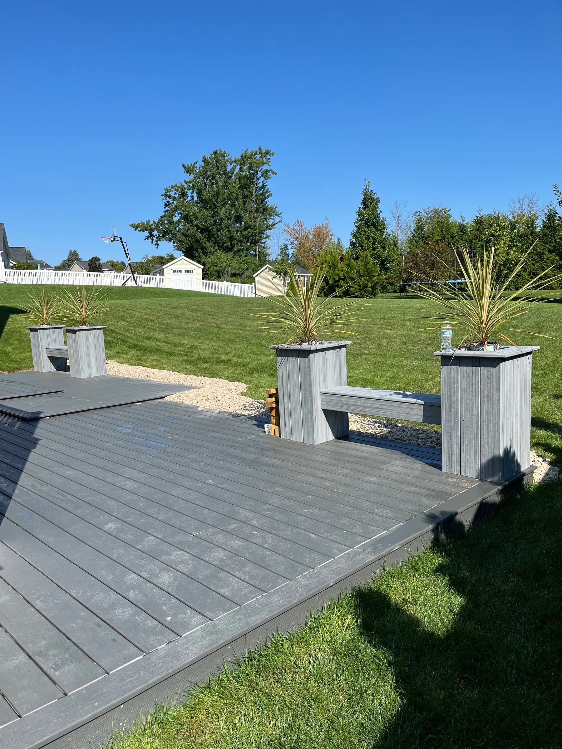 Gray composite deck floor with planter boxes