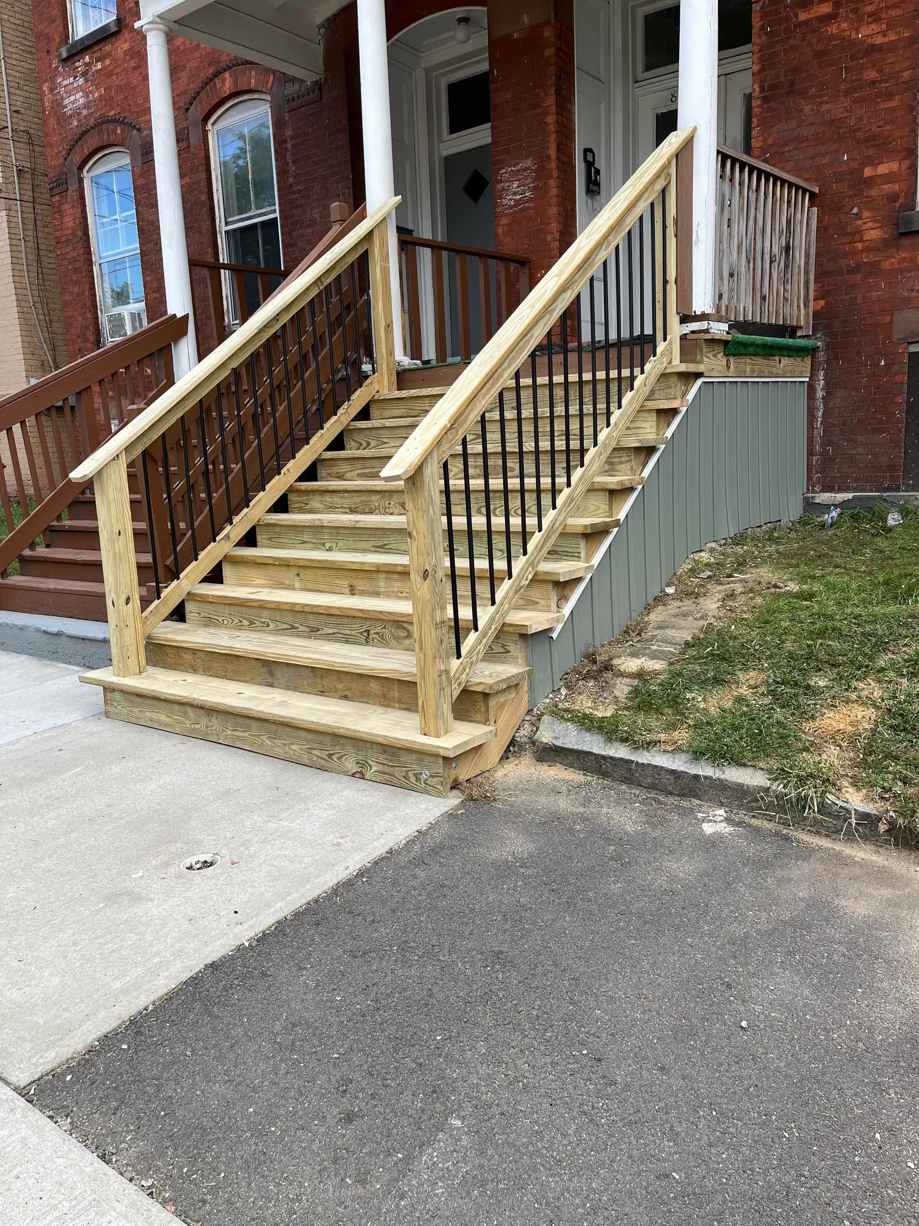 Backyard wooden deck framing with posts