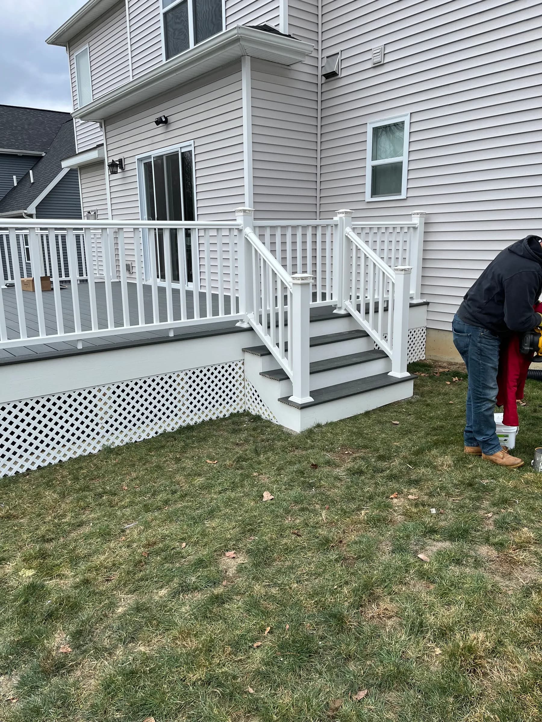 White deck from overhead angle with client on lawn