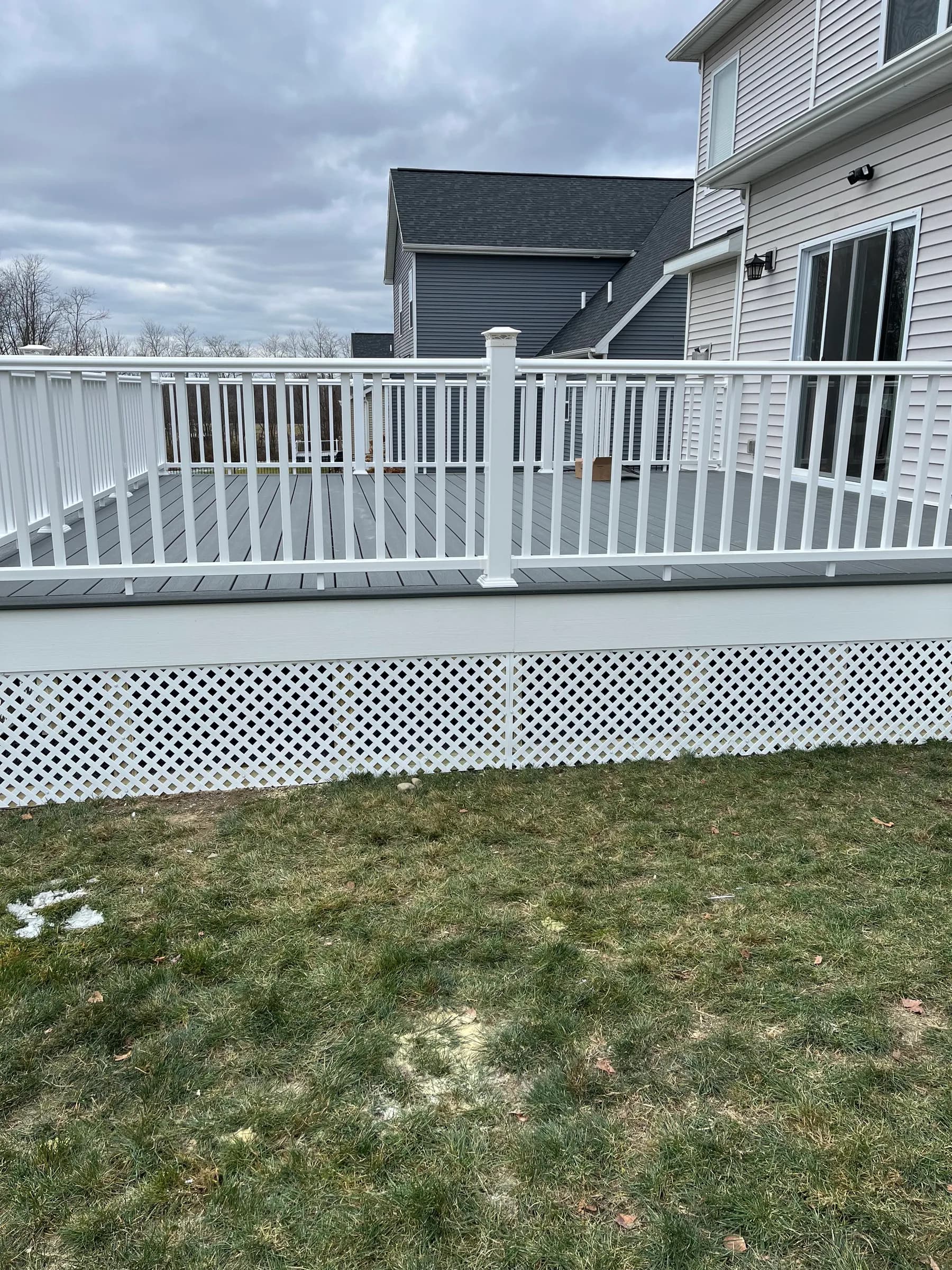 Stair side view of white vinyl deck
