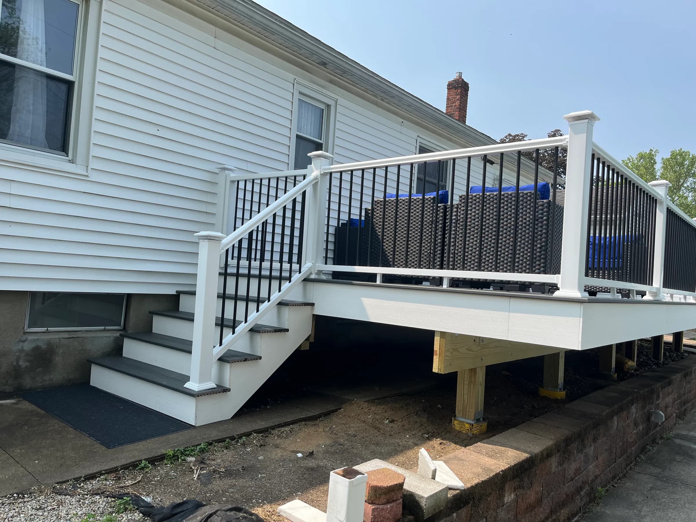 White vinyl deck with black balusters mid-construction
