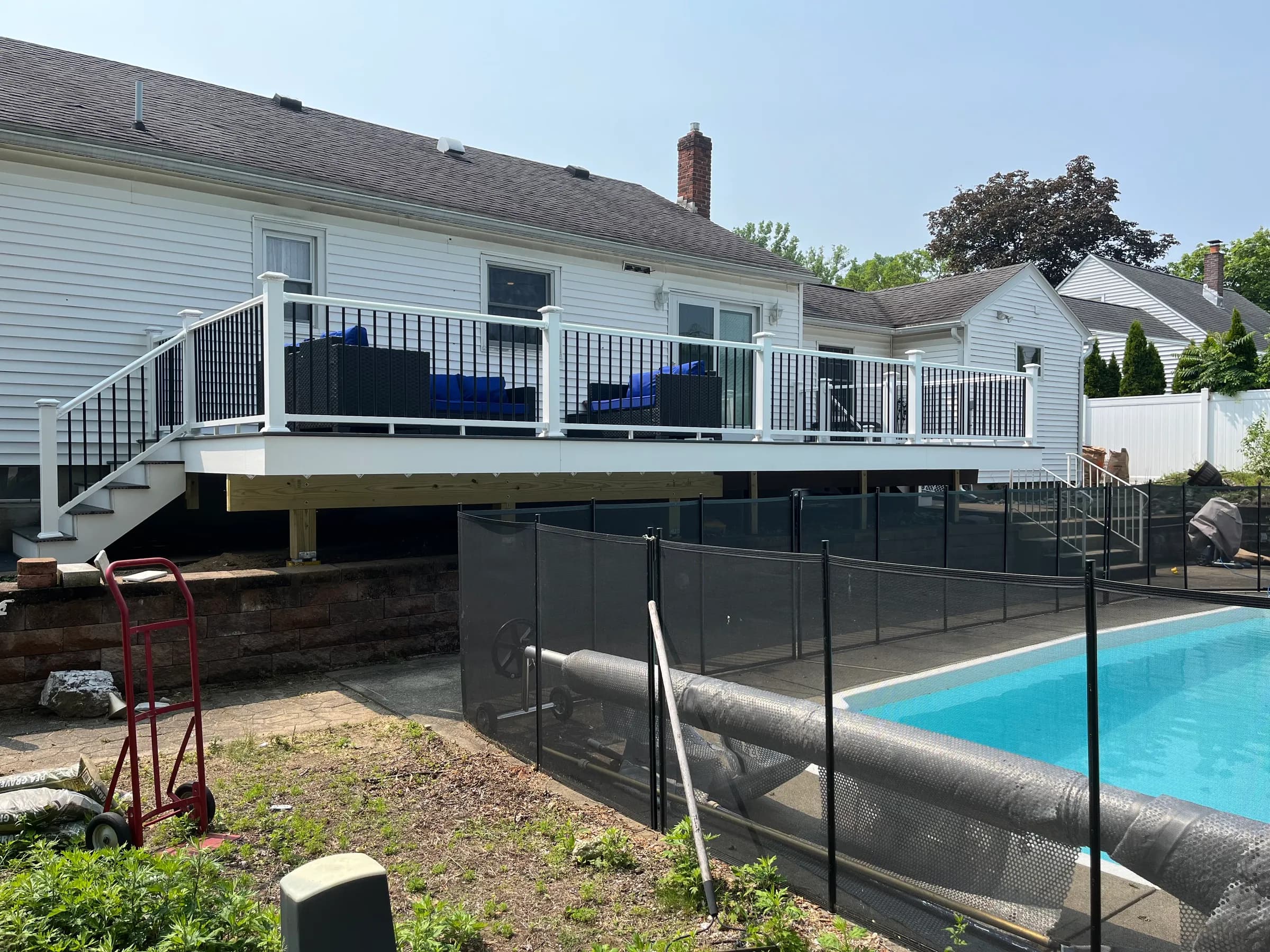 Elevated deck in progress beside pool