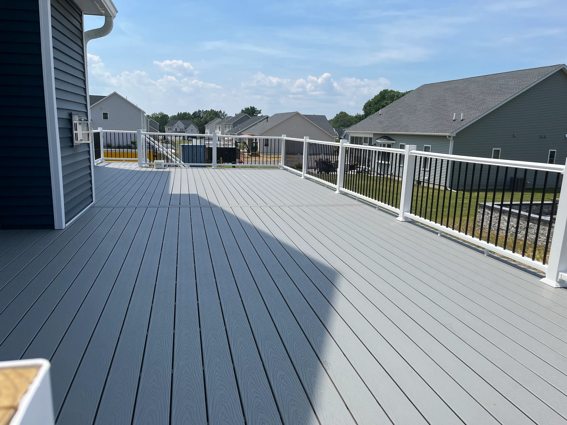 Gray composite deck with black aluminum railings