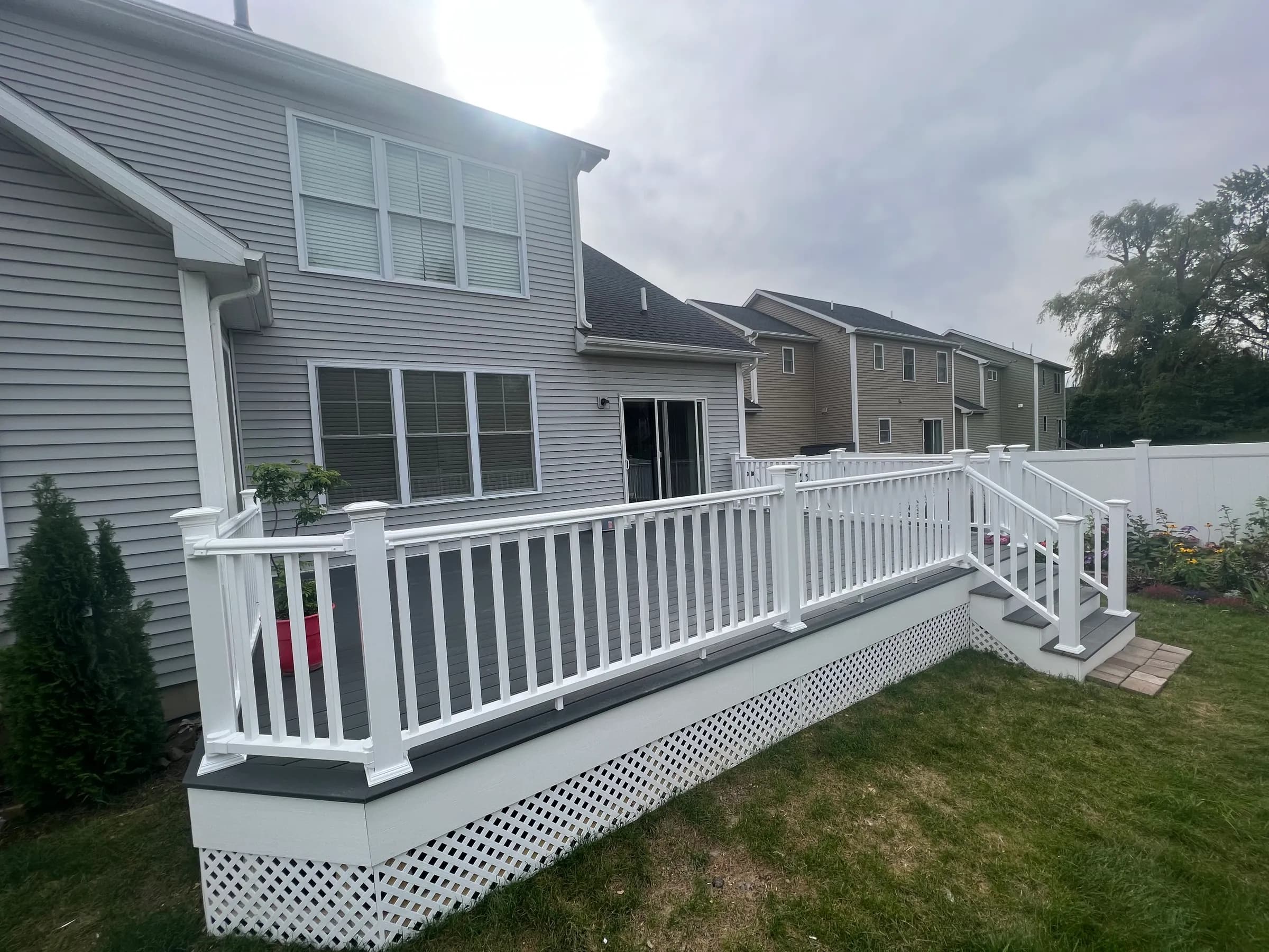 White staircase angle with railings and balusters