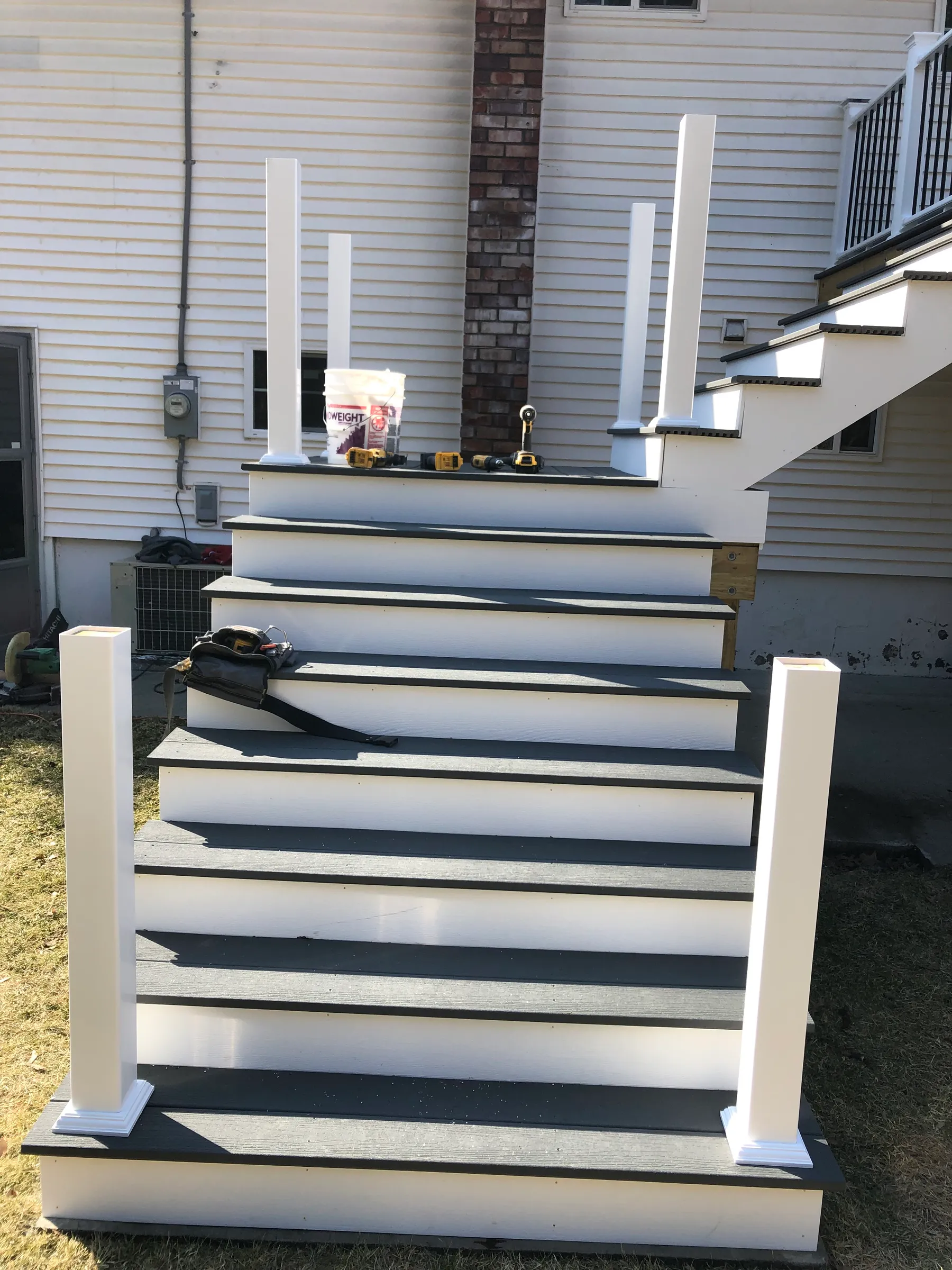 White porch with steps and composite decking