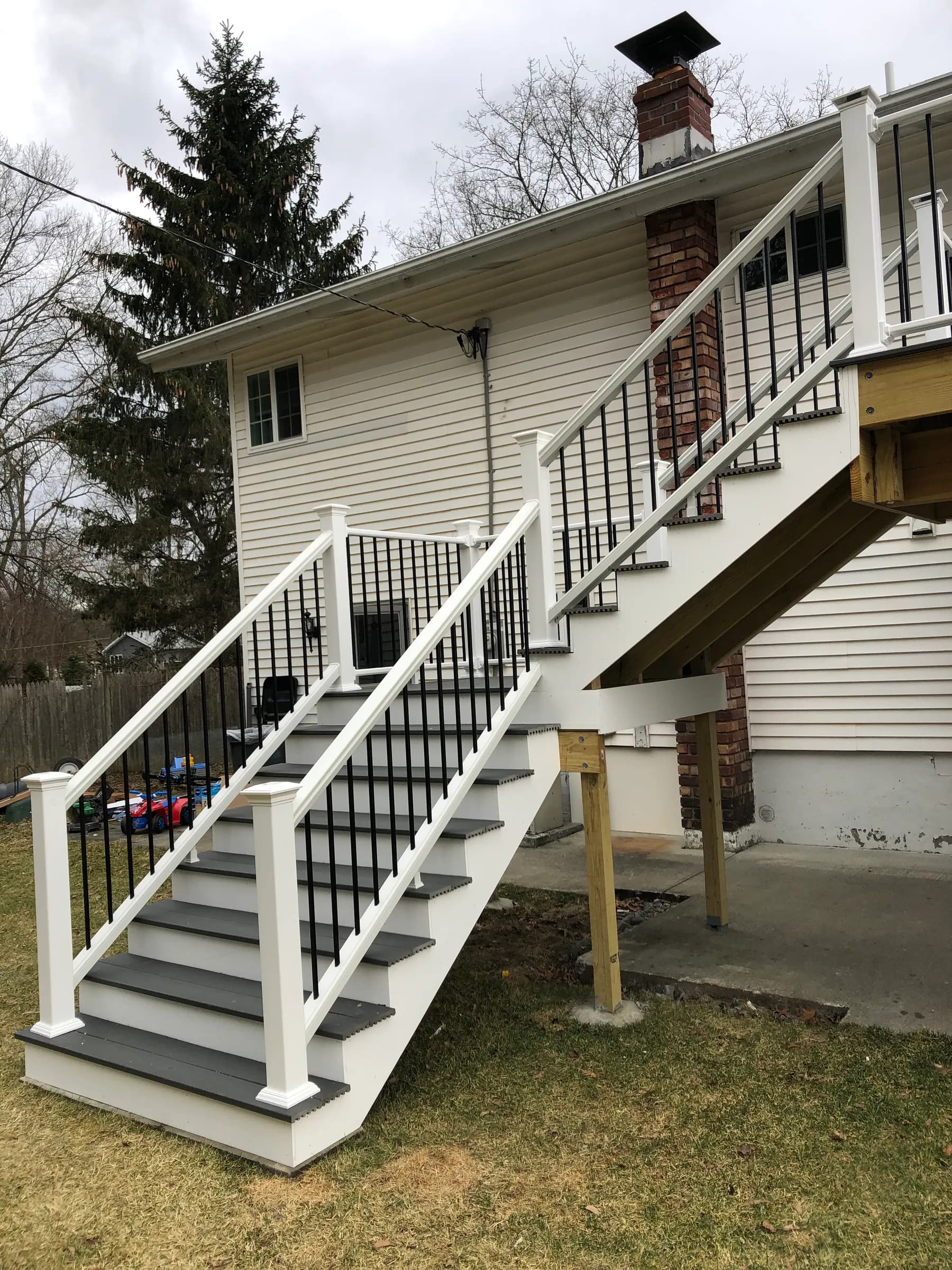 White stair tower with composite treads and piers