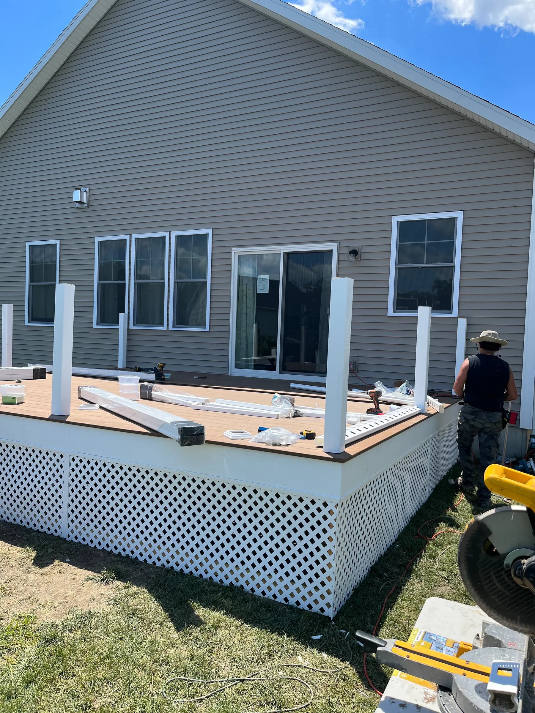 House with deck mid-construction posts visible