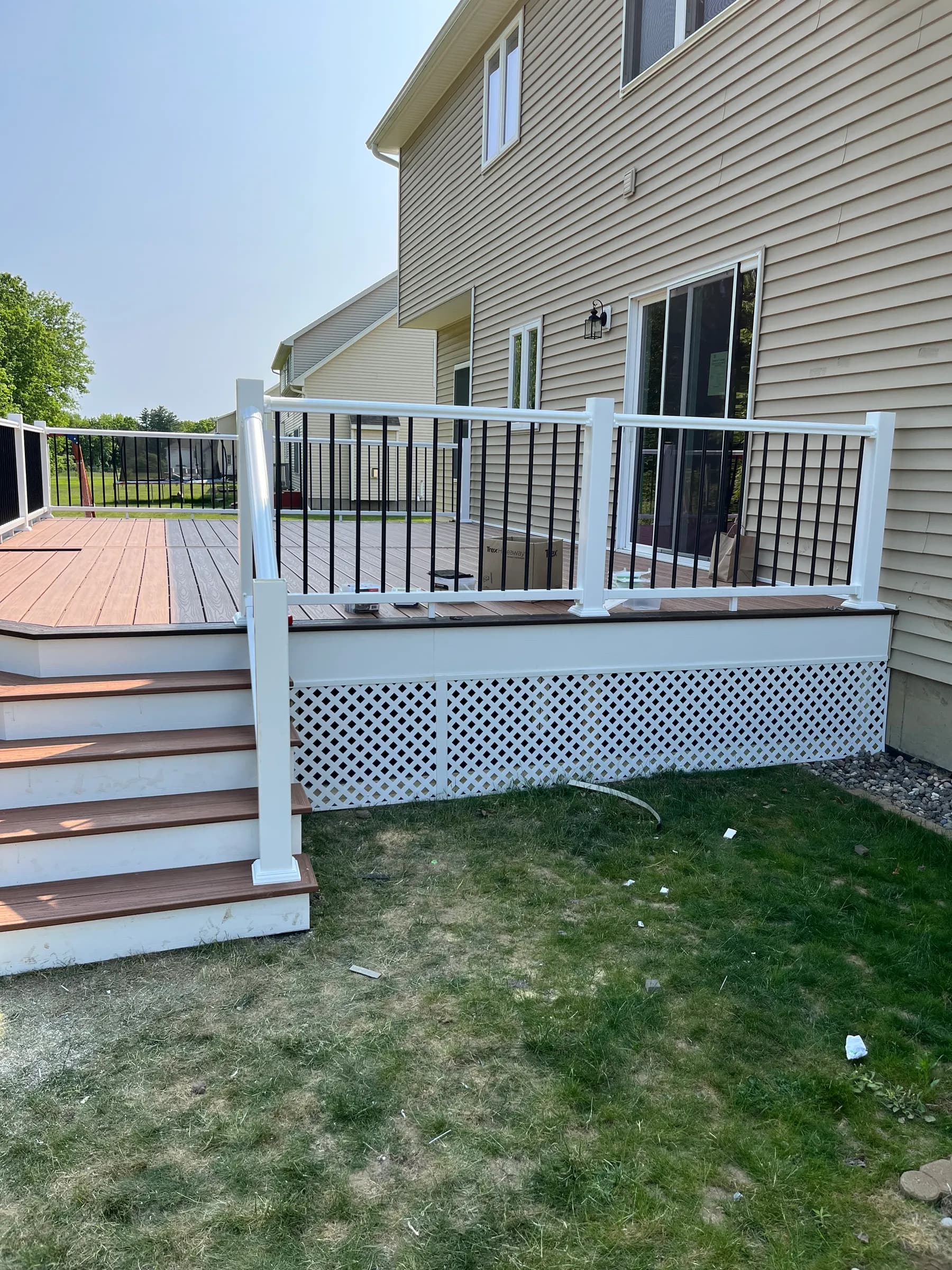 Side view of white deck with lattice skirt